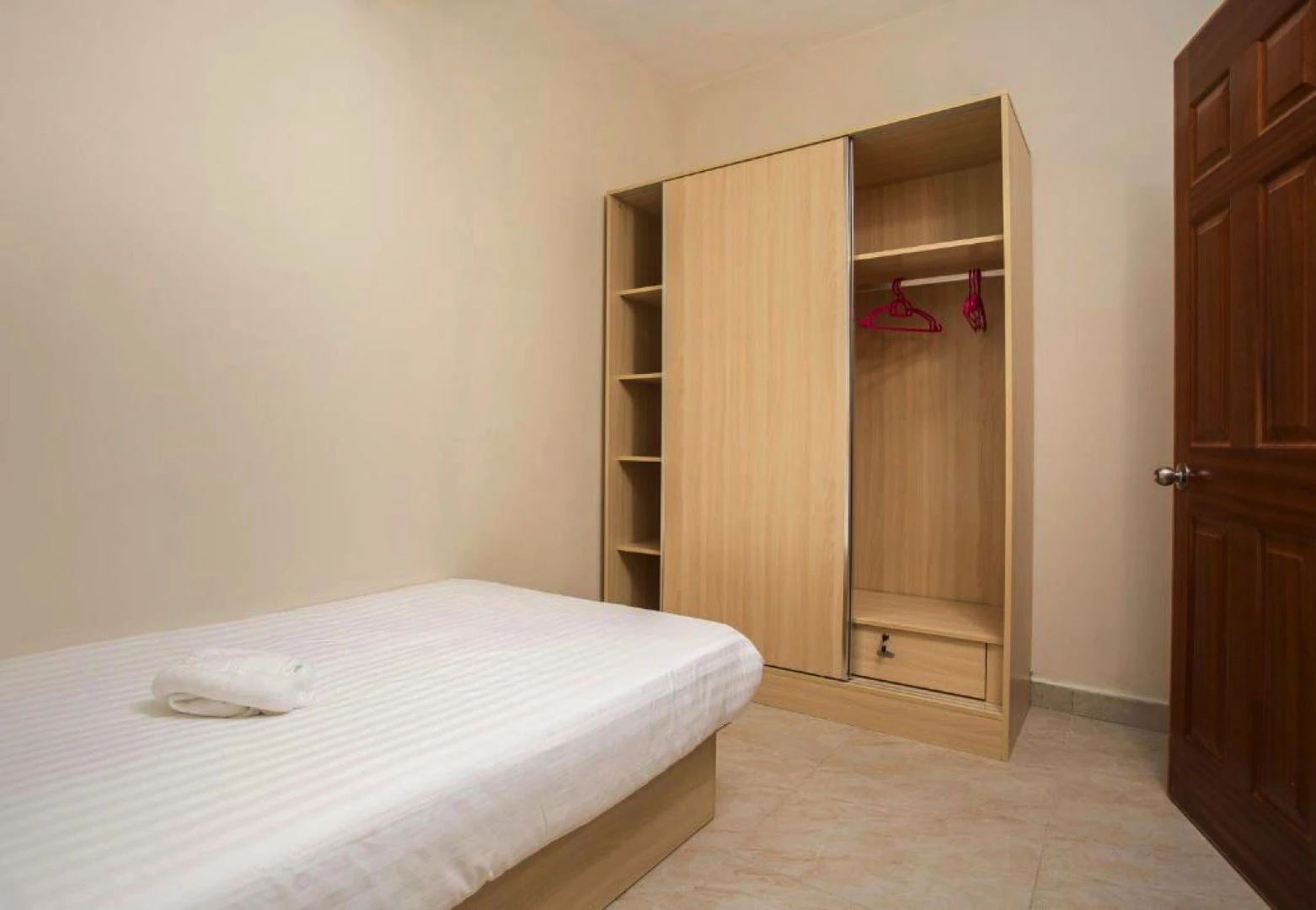 Single bedroom inside a triple apartment at Residence Potosi, ideal for family stays